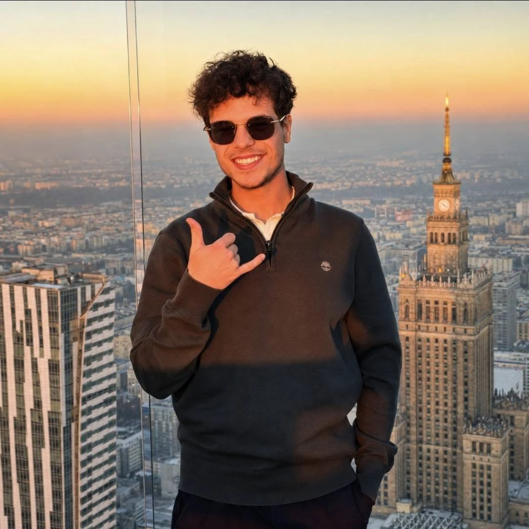 Alexander TGS standing in front of a city skyline